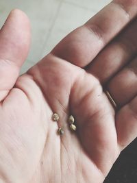 Close-up of hand holding small baby