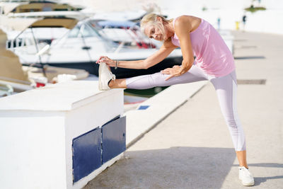 Full length of woman exercising in gym