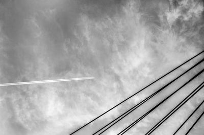 Low angle view of vapor trails against sky