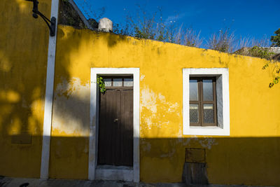 Yellow door of house