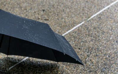 High angle view of wet umbrella