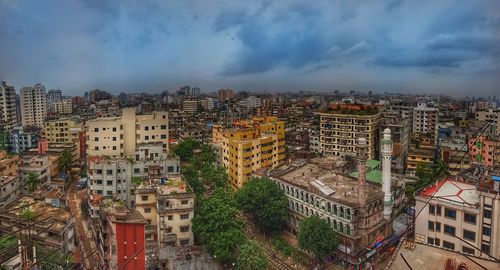 High angle view of buildings in city against sky