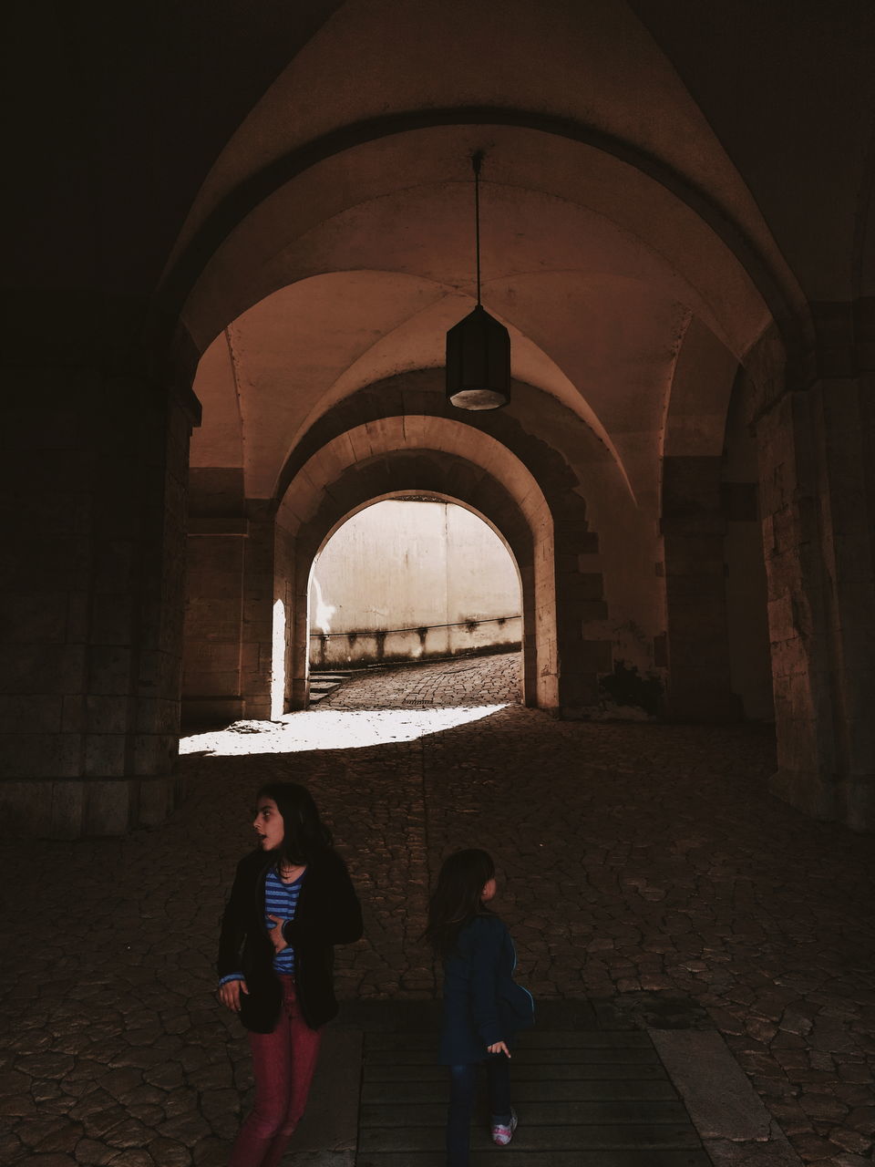 arch, architecture, built structure, women, real people, building, two people, standing, lifestyles, indoors, the past, leisure activity, togetherness, females, history, people, adult, men, full length, architectural column