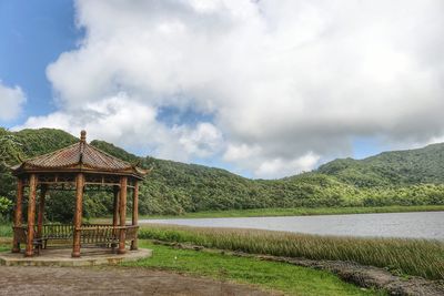 Built structure on landscape against sky