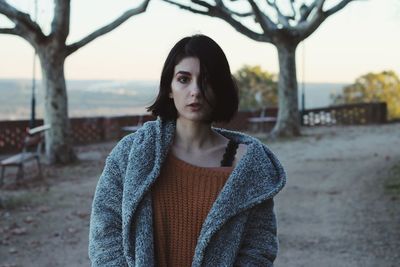 Portrait of young woman wearing warm clothing during winter