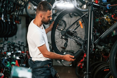 Man repairing bicycle