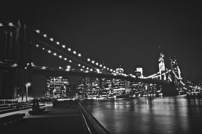 Illuminated bridge at night