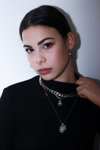 Portrait of beautiful young woman over white background