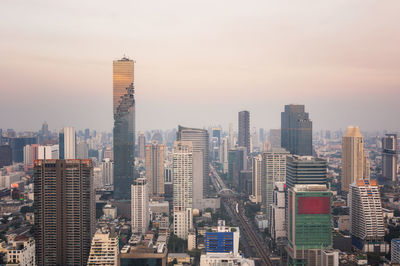 Modern buildings in city against sky