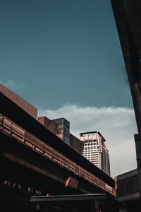 Low angle view of buildings against sky in city