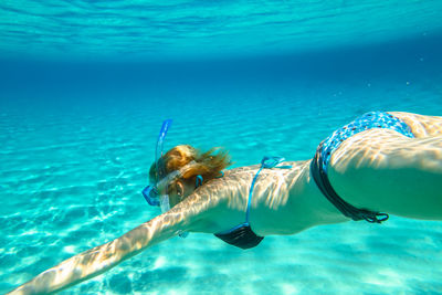 Woman swimming in sea