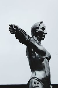 Low angle view of statue against sky