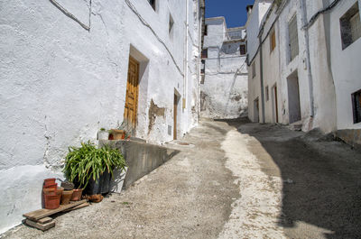 Alley amidst buildings in city