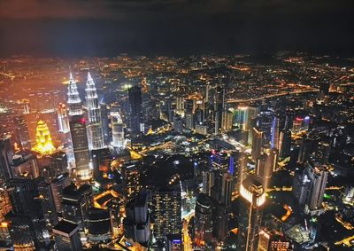 High angle view of illuminated cityscape at night