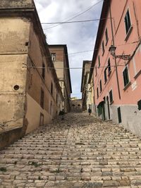 Footpath amidst buildings in town