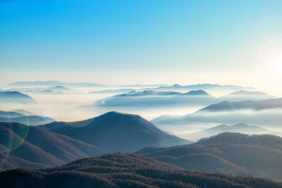 Scenic view of mountains against sky during sunset