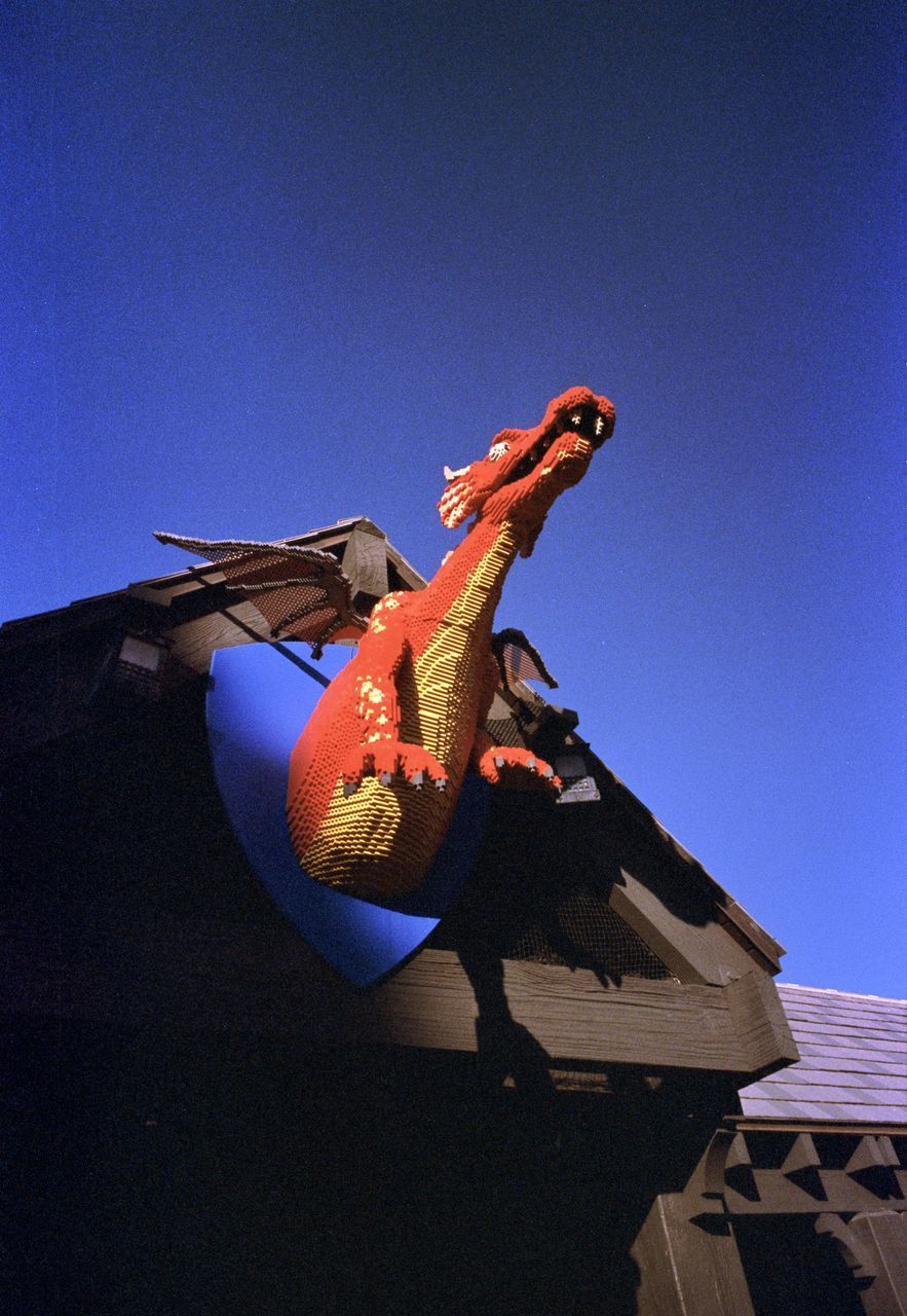 LOW ANGLE VIEW OF PERSON AGAINST BLUE SKY