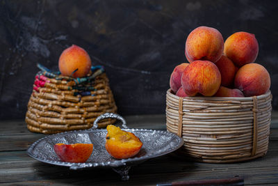 Fruits in basket on table