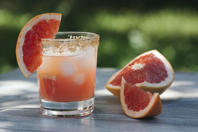 Grapefruit juice on the table outdoors