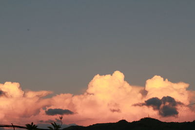 Low angle view of mountain against sky at sunset