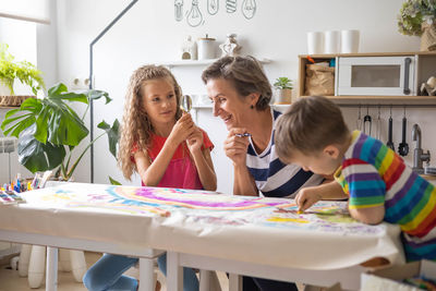 Mother and daughter sitting at home