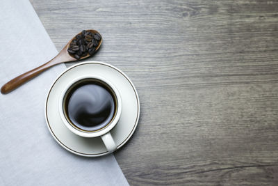 High angle view of coffee cup on table