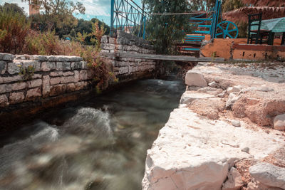 Scenic view of river flowing through rocks