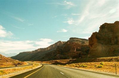 Country road leading towards mountains