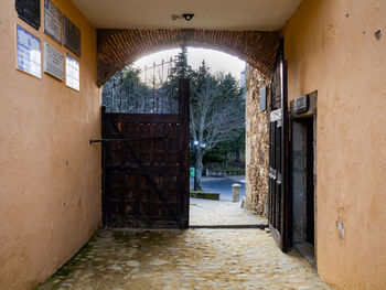 Empty alley amidst buildings in city