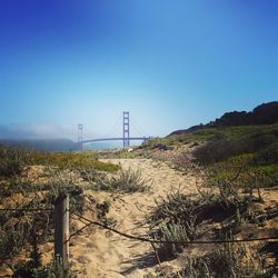 Suspension bridge against blue sky