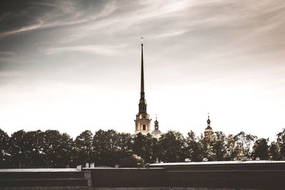 View of tower of building against cloudy sky