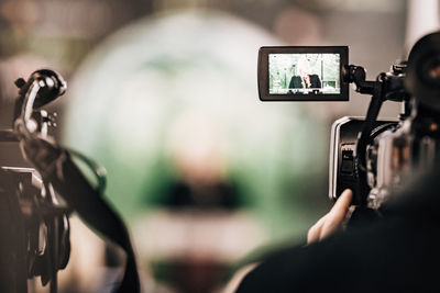 Cameraman recording a media event