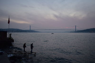 View of suspension bridge over sea