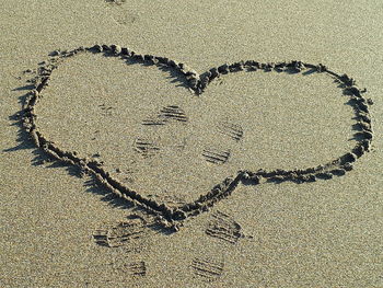 Directly above shot of heart shape on sand