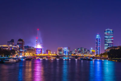 Illuminated buildings in city at night