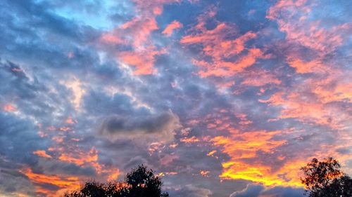 Low angle view of cloudy sky at sunset