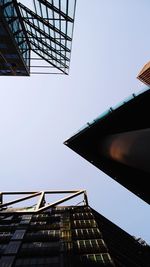 Low angle view of buildings against clear blue sky