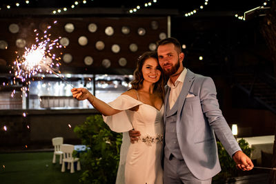 Portrait of smiling young couple