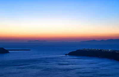 Scenic view of sea against clear sky during sunset