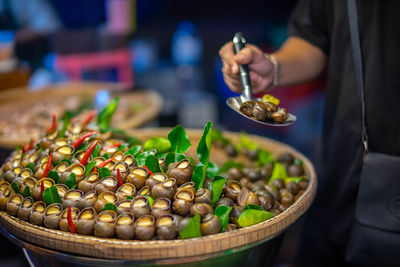 Midsection of man preparing food