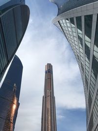 Low angle view of modern buildings against sky