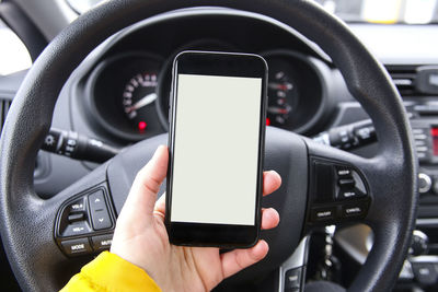 Close-up of hand using mobile phone