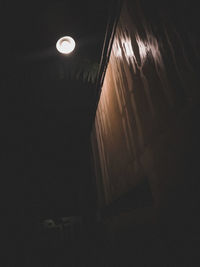 High angle view of illuminated light fixture on ceiling of building