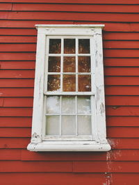 Window on red wall