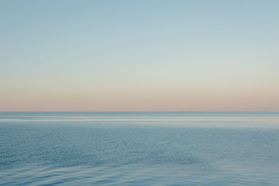 Scenic view of sea against clear sky during sunset