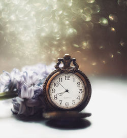 Close-up of clock on table