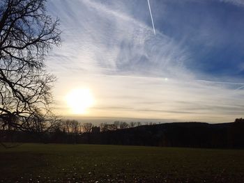 Scenic view of field against sky during sunset