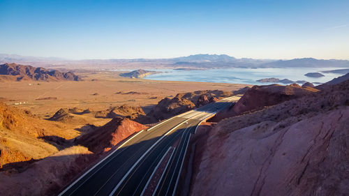 High angle view of road amidst mountains against sky