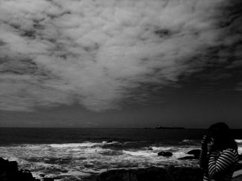 Scenic view of sea against cloudy sky