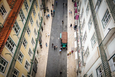 High angle view of people walking on street of city